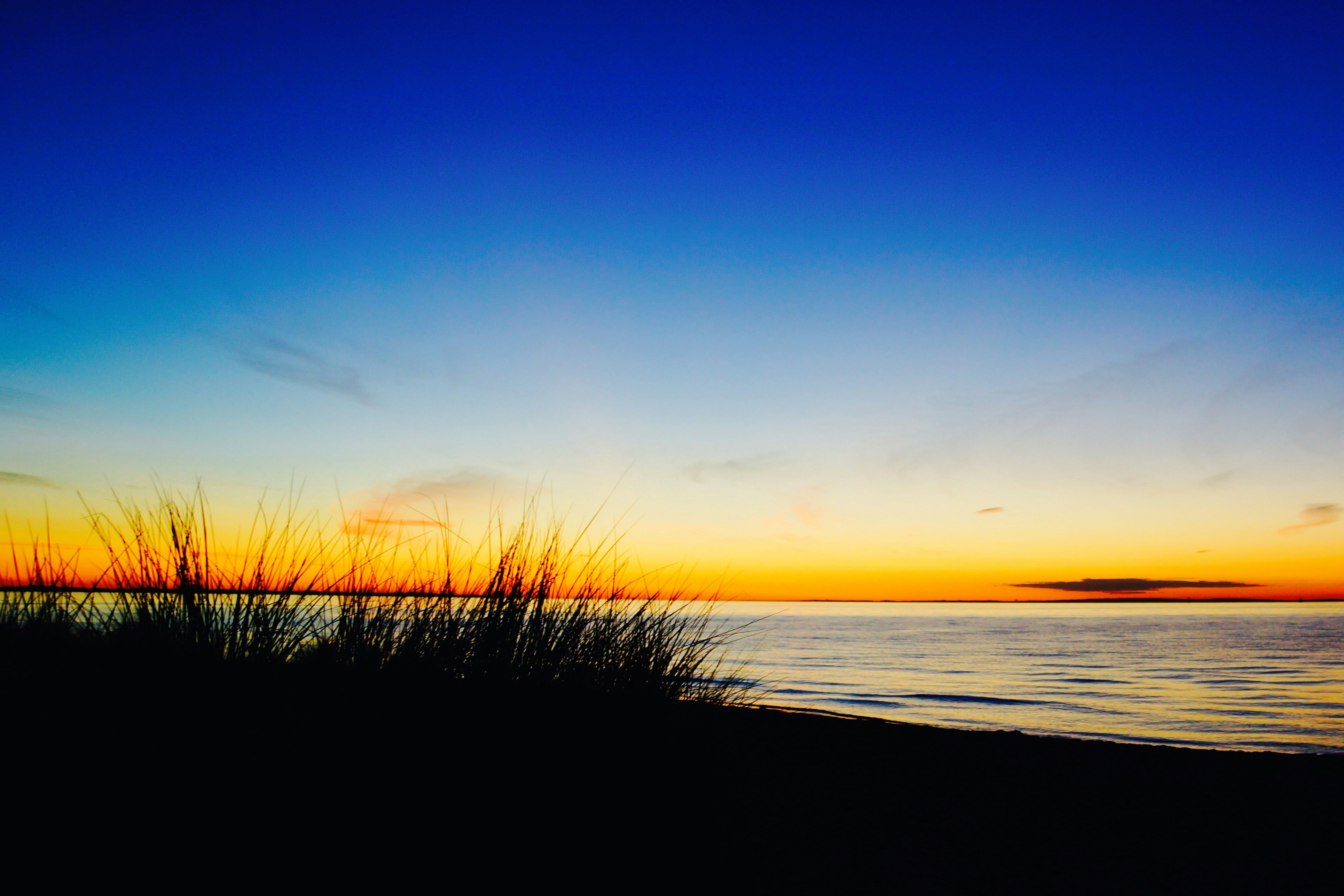 sunset across body of water